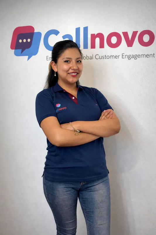 A Callnovo customer support agent at a workstation, ready to take over emails the AI escalates