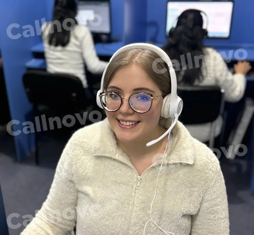 A Callnovo customer support agent at a workstation, ready to take over emails the AI escalates