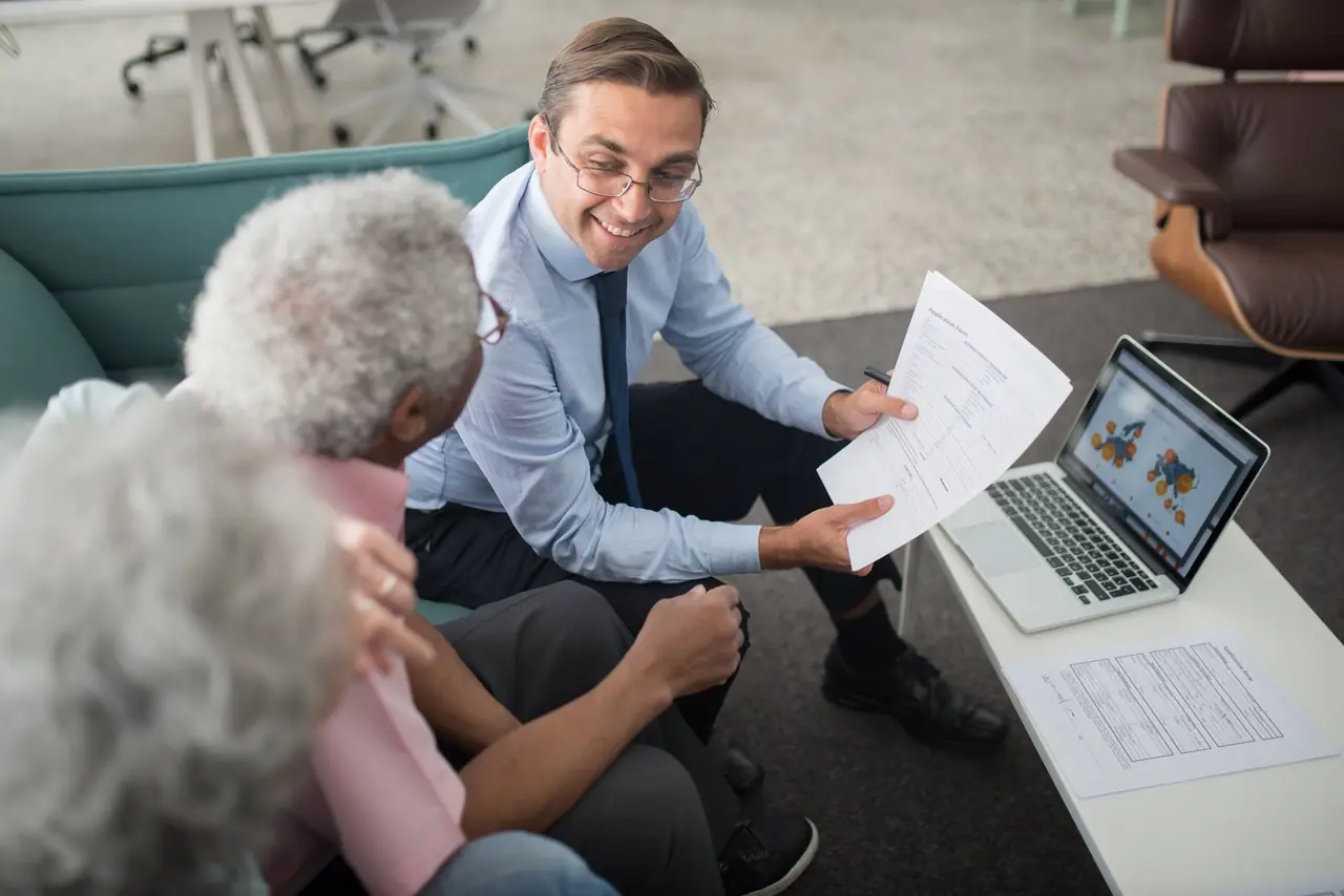 An advisor going through documents with clients