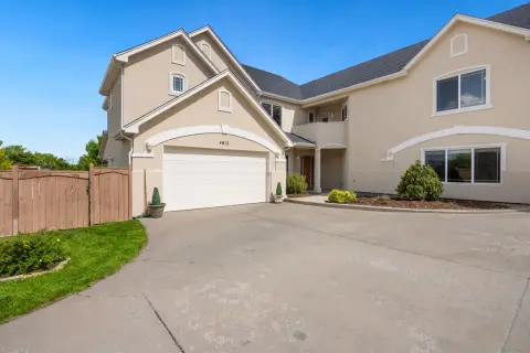 A suburban house with a closed double garage door