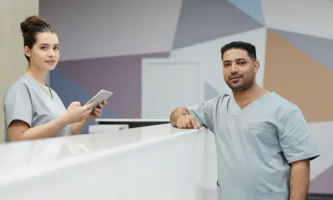 Clinical staff at a modern medical clinic reception