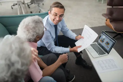 An advisor going through documents with clients